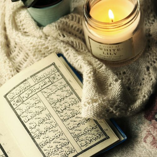 Photo Of Quran Beside Lighted Candle